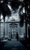 Sacred Hearts Fathers James Beynes, Bruno Bens, and Francis Steffen stand in front of Maria Lanakila Church, Lahaina, Maui.